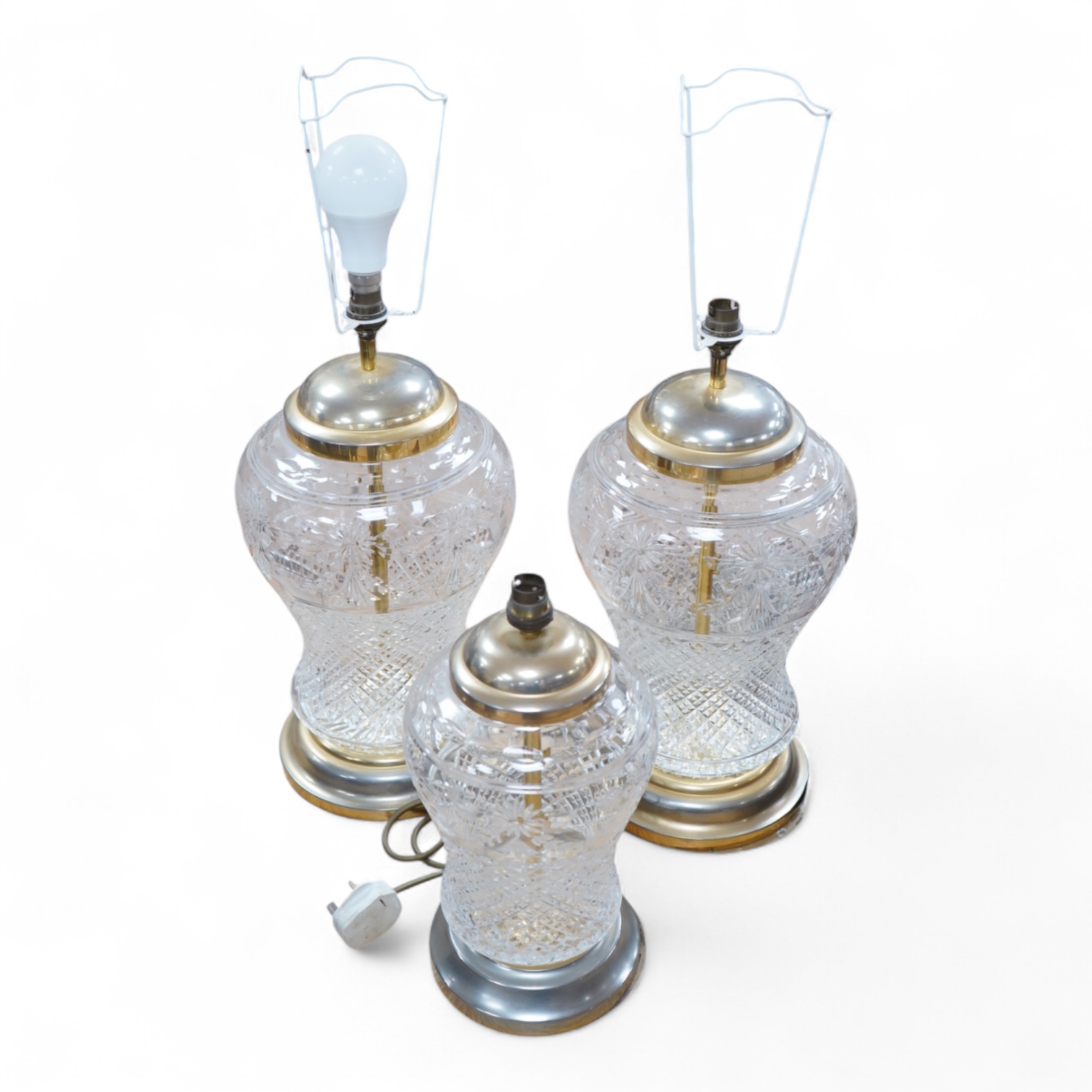 A pair of Waterford glass table lamps, 40 cm high and a smaller similar lamp